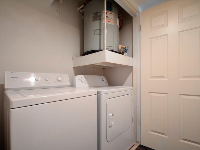 501 W 26th St Unit 102, Austin, TX 78705 - washroom with washer and dryer and water heater
