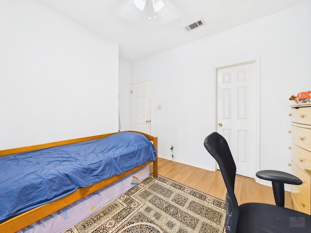 3111 Tom Green St Unit 208, Austin, TX 78705 - bedroom with light wood-type flooring and ceiling fan