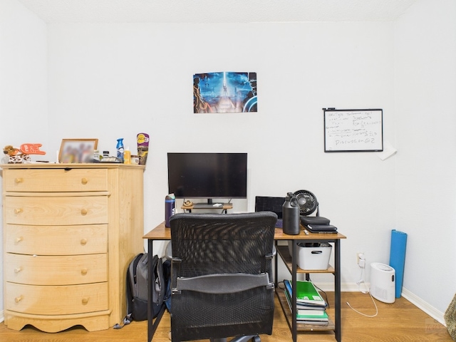 3111 Tom Green St Unit 208, Austin, TX 78705 - office area with light wood-style floors and baseboards