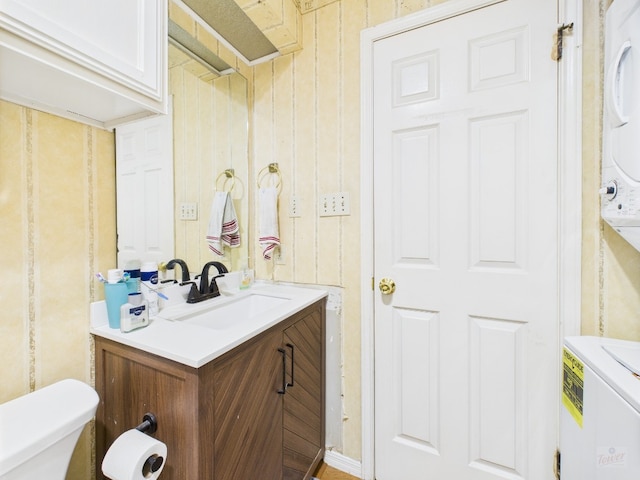 3111 Tom Green St Unit 208, Austin, TX 78705 - bathroom featuring vanity and stacked washer and clothes dryer