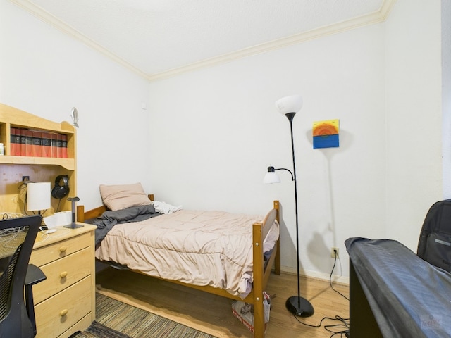 3111 Tom Green St Unit 208, Austin, TX 78705 - bedroom with ornamental molding and light wood-style floors