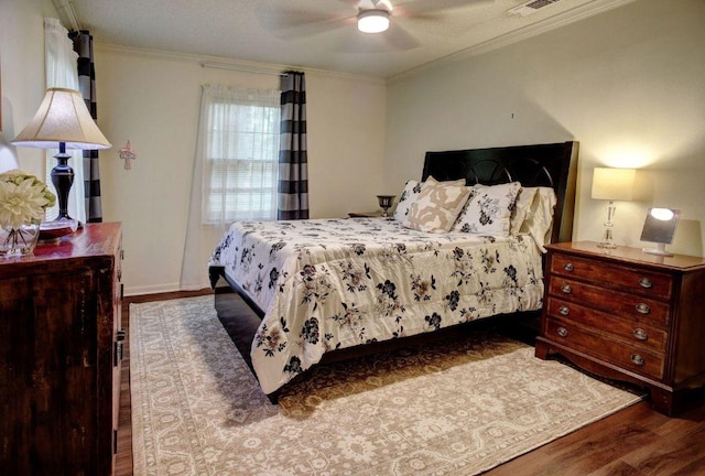 4703 Laguna Ln, Austin, TX 78746 - bedroom with wood finished floors, ornamental molding, and ceiling fan
