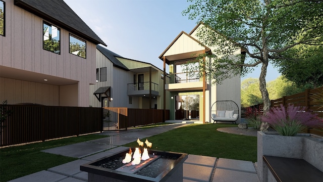 1208 Karen Ave Unit 3, Austin, TX 78757 - fenced yard with an outdoor fire pit, a gate, and a balcony