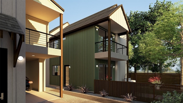 1208 Karen Ave Unit 3, Austin, TX 78757 - view of home's exterior featuring a balcony and a shingled roof