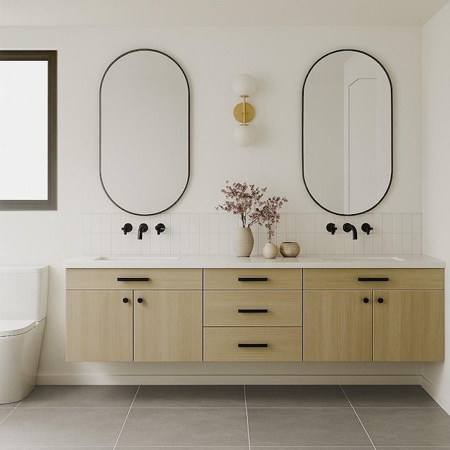 1208 Karen Ave Unit 3, Austin, TX 78757 - bathroom featuring double vanity, tile patterned flooring, and decorative backsplash