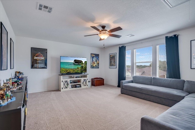 229 Mary Max Cir, San Marcos, TX 78666 - living area featuring carpet flooring, a ceiling fan, and a textured ceiling