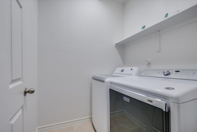 229 Mary Max Cir, San Marcos, TX 78666 - laundry area with washer and dryer and baseboards