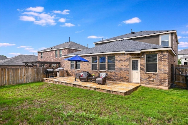 229 Mary Max Cir, San Marcos, TX 78666 - rear view of property featuring a patio area, a fenced backyard, brick siding, and roof with shingles