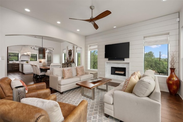 1404 Hurst Creek Rd, Austin, TX 78734 - living room with a ceiling fan, wood finished floors, recessed lighting, a high end fireplace, and arched walkways