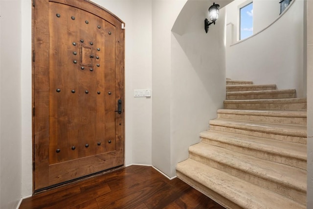 1404 Hurst Creek Rd, Austin, TX 78734 - entrance foyer featuring arched walkways, wood finished floors, and stairway