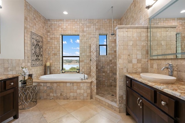 1404 Hurst Creek Rd, Austin, TX 78734 - bathroom with tile walls, vanity, a bath, a tile shower, and tile patterned flooring