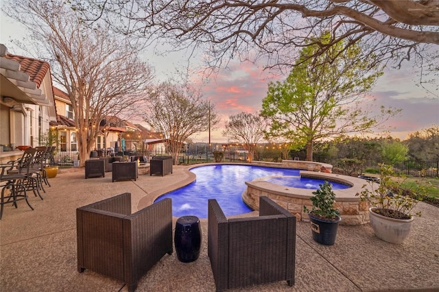 11208 Woodland Hills Trl, Austin, TX 78732 - pool at dusk with a patio area and a pool with connected hot tub