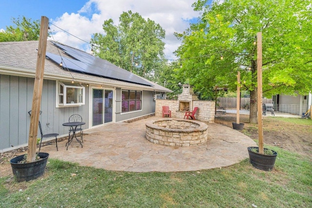 3705 Peach Vista Dr, Pflugerville, TX 78660 - fenced backyard with an outdoor stone fireplace and a patio area