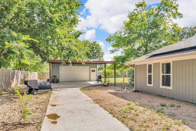 3705 Peach Vista Dr, Pflugerville, TX 78660 - view of yard with an outbuilding, a garage, and concrete driveway