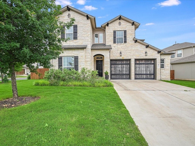6701 Denia Dr, Austin, TX 78739 - view of front of property with stone siding, concrete driveway, a front lawn, and an attached garage