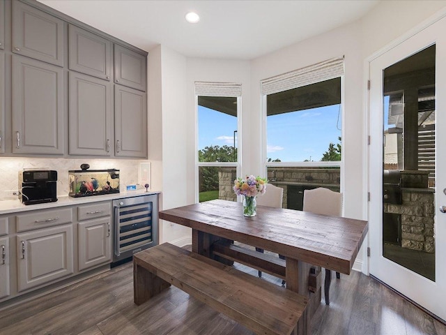 6701 Denia Dr, Austin, TX 78739 - dining room with wine cooler, dark wood finished floors, recessed lighting, and a dry bar