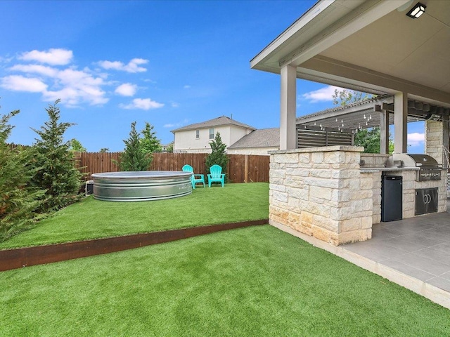 6701 Denia Dr, Austin, TX 78739 - fenced backyard featuring area for grilling and a patio area