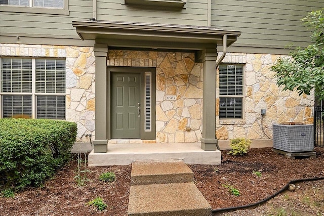 3101 Davis Ln Unit 6503, Austin, TX 78748 - doorway to property featuring stone siding