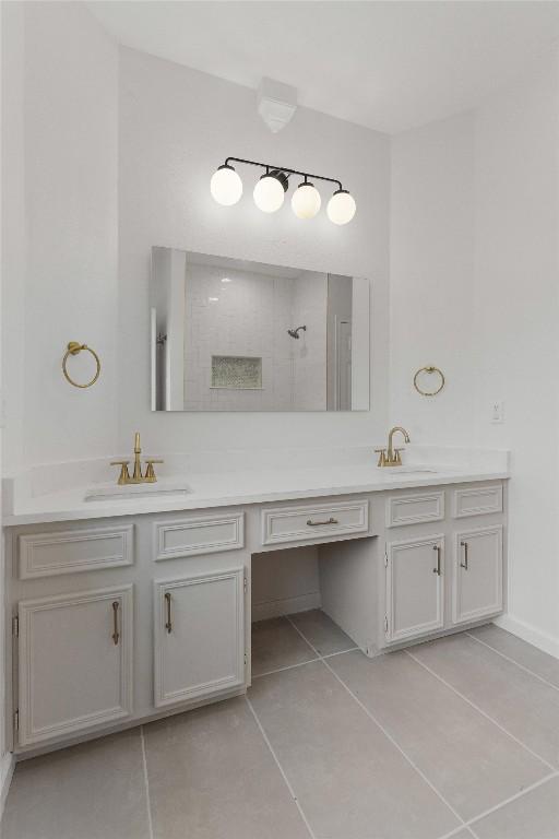 7401 Whistlestop Dr, Austin, TX 78749 - full bath with double vanity, tile patterned flooring, and a tile shower