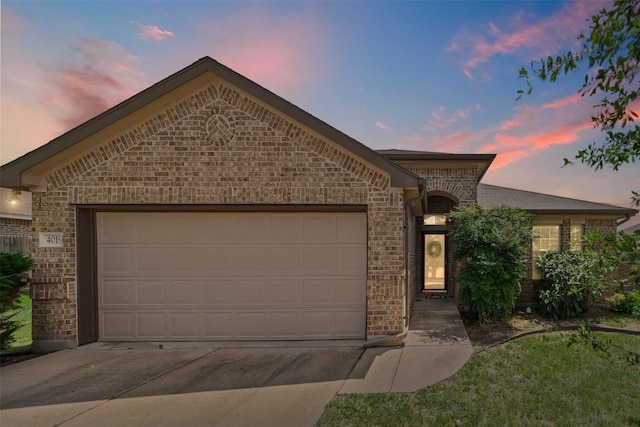 4019 Brookhaven Dr, Temple, TX 76504 - french country home featuring concrete driveway, brick siding, and a garage