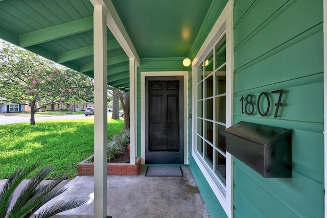 1807 W Saint Johns Ave, Austin, TX 78757 - doorway to property with a lawn and a porch