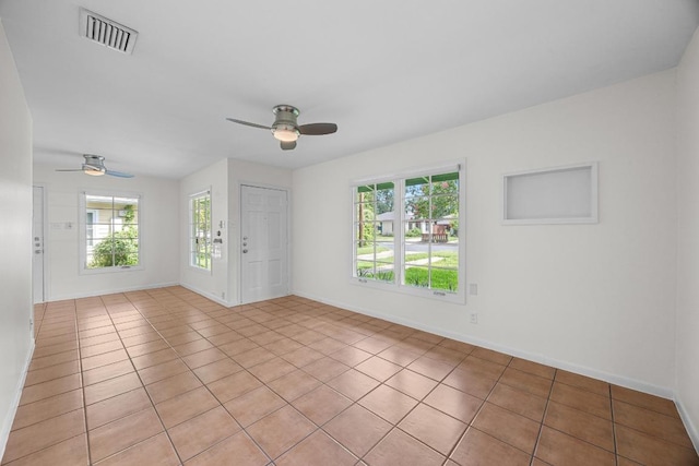 1807 W Saint Johns Ave, Austin, TX 78757 - spare room featuring ceiling fan and light tile patterned flooring