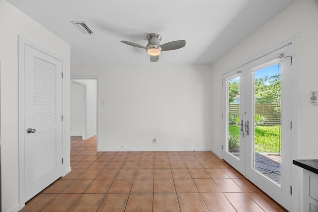 1807 W Saint Johns Ave, Austin, TX 78757 - empty room with light tile patterned flooring and a ceiling fan