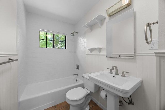 1807 W Saint Johns Ave, Austin, TX 78757 - bathroom featuring tile patterned floors, tub / shower combination, and a wainscoted wall