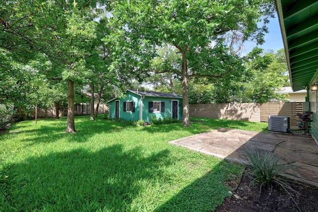 1807 W Saint Johns Ave, Austin, TX 78757 - fenced backyard with a patio and an outdoor structure