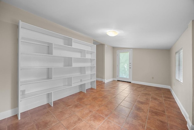 1807 W Saint Johns Ave, Austin, TX 78757 - empty room with baseboards and light tile patterned floors