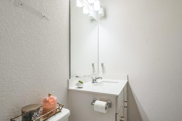14521 Kira Ln, Manor, TX 78653 - half bathroom with vanity and a textured wall