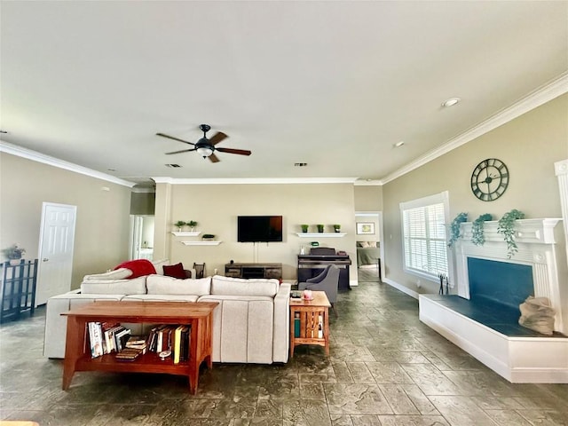 1127 Robin Rd, Elgin, TX 78621 - living room featuring a fireplace with raised hearth, ceiling fan, crown molding, and recessed lighting