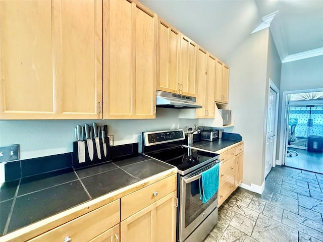 1127 Robin Rd, Elgin, TX 78621 - kitchen with stainless steel range with electric cooktop, under cabinet range hood, light brown cabinetry, tile countertops, and crown molding