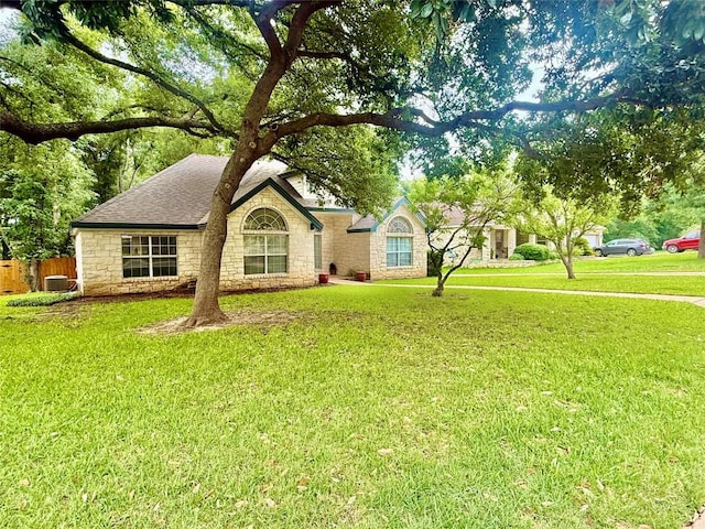 1127 Robin Rd, Elgin, TX 78621 - view of front of house with stone siding and a shingled roof