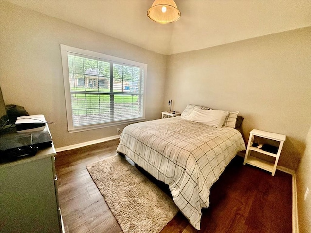 1127 Robin Rd, Elgin, TX 78621 - bedroom featuring dark wood-style flooring and baseboards
