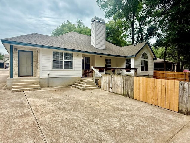 1127 Robin Rd, Elgin, TX 78621 - back of property featuring a chimney and a shingled roof