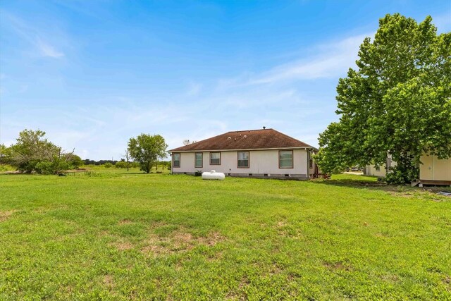 12212 Ballerstedt Rd, Elgin, TX 78621 - rear view of property with a lawn