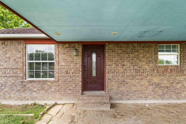 12212 Ballerstedt Rd, Elgin, TX 78621 - doorway to property featuring brick siding