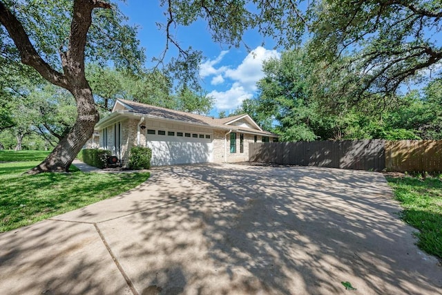 10507 Spicewood Pkwy, Austin, TX 78750 - view of front facade featuring a garage and concrete driveway