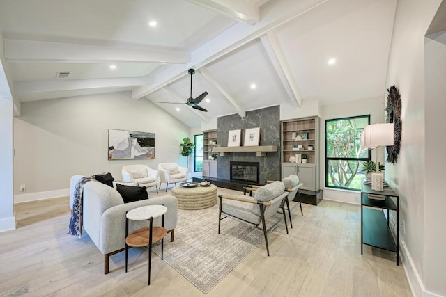 10507 Spicewood Pkwy, Austin, TX 78750 - living room featuring light wood-style floors, a ceiling fan, a high end fireplace, and recessed lighting