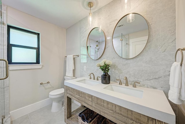 10507 Spicewood Pkwy, Austin, TX 78750 - bathroom with tile patterned flooring, a shower with door, double vanity, and tile walls