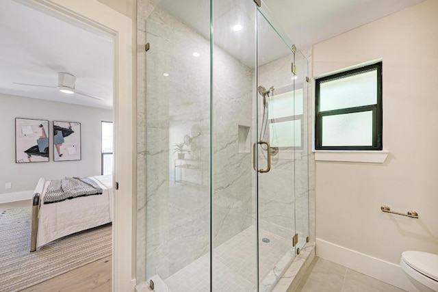 10507 Spicewood Pkwy, Austin, TX 78750 - ensuite bathroom with baseboards and a stall shower