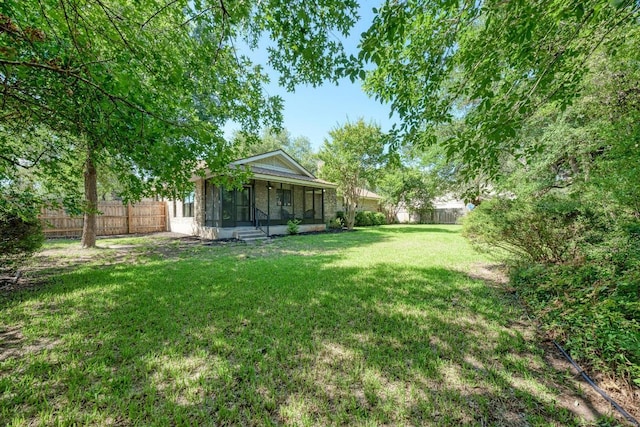 10507 Spicewood Pkwy, Austin, TX 78750 - fenced backyard featuring a sunroom