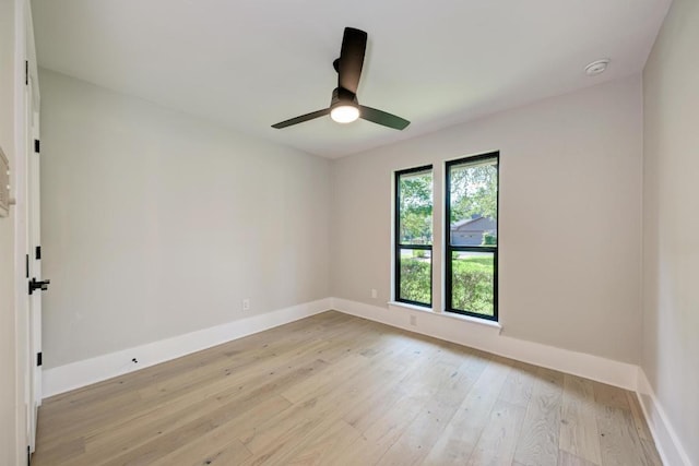 10507 Spicewood Pkwy, Austin, TX 78750 - unfurnished room with light wood-style flooring, a smoke detector, and a ceiling fan