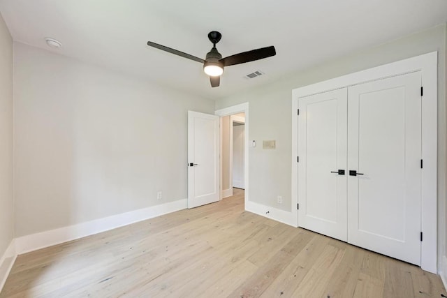 10507 Spicewood Pkwy, Austin, TX 78750 - unfurnished bedroom featuring light wood finished floors, a closet, and a ceiling fan