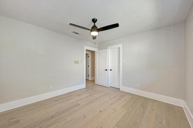 10507 Spicewood Pkwy, Austin, TX 78750 - empty room with light wood-style flooring and a ceiling fan