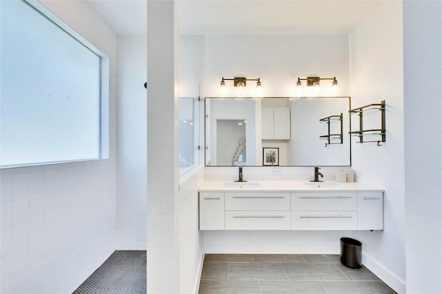 405 Alva Dr, Spicewood, TX 78669 - bathroom with double vanity, a walk in shower, and tile patterned flooring