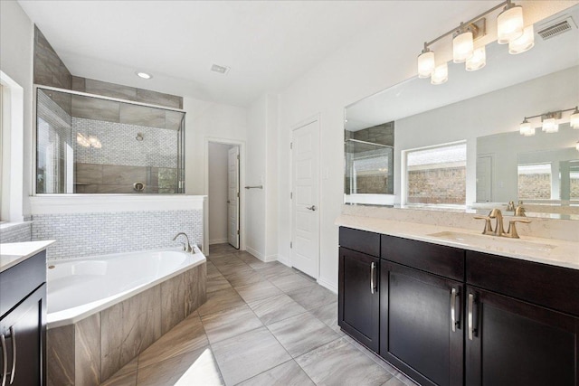 123 Pond View Pass, Buda, TX 78610 - full bathroom featuring vanity, a shower stall, a bath, and recessed lighting
