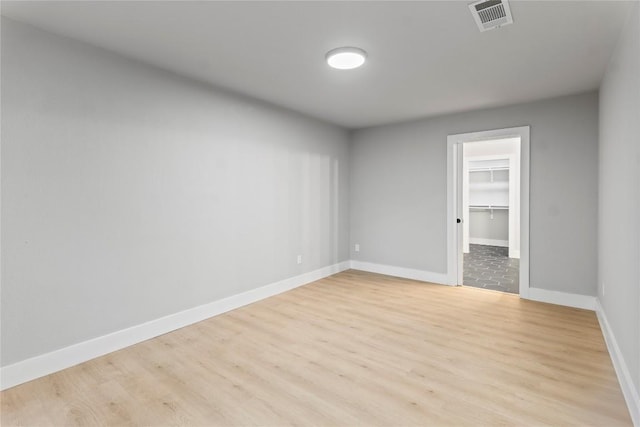 3907 Carmel Dr, Austin, TX 78721 - unfurnished room featuring light wood finished floors and baseboards