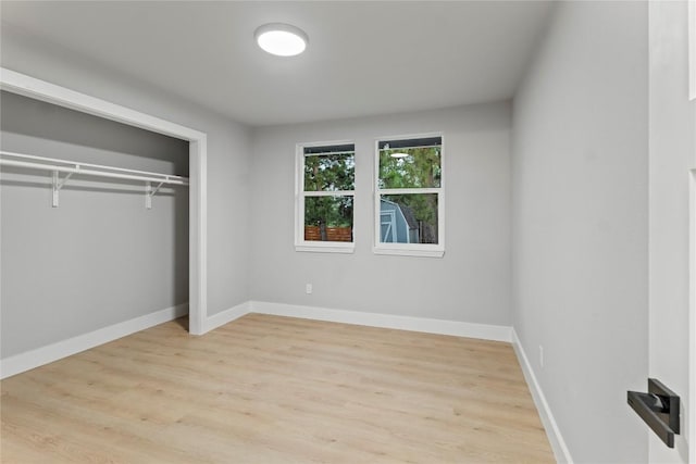 3907 Carmel Dr, Austin, TX 78721 - unfurnished bedroom with light wood-style flooring and a closet